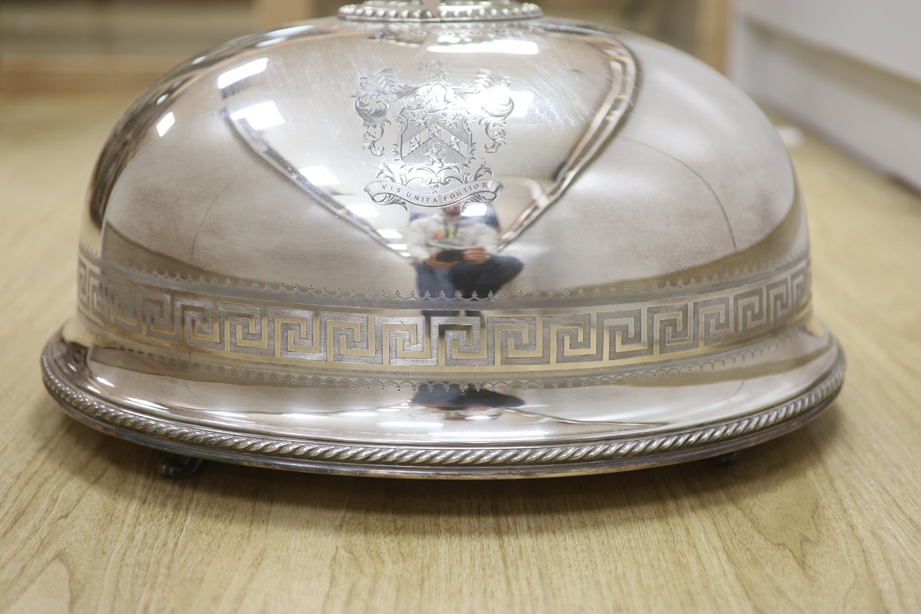 A Victorian electro-plated meat cover by Elkington having Greek key pattern and armorial, with associated venison dish, overall height